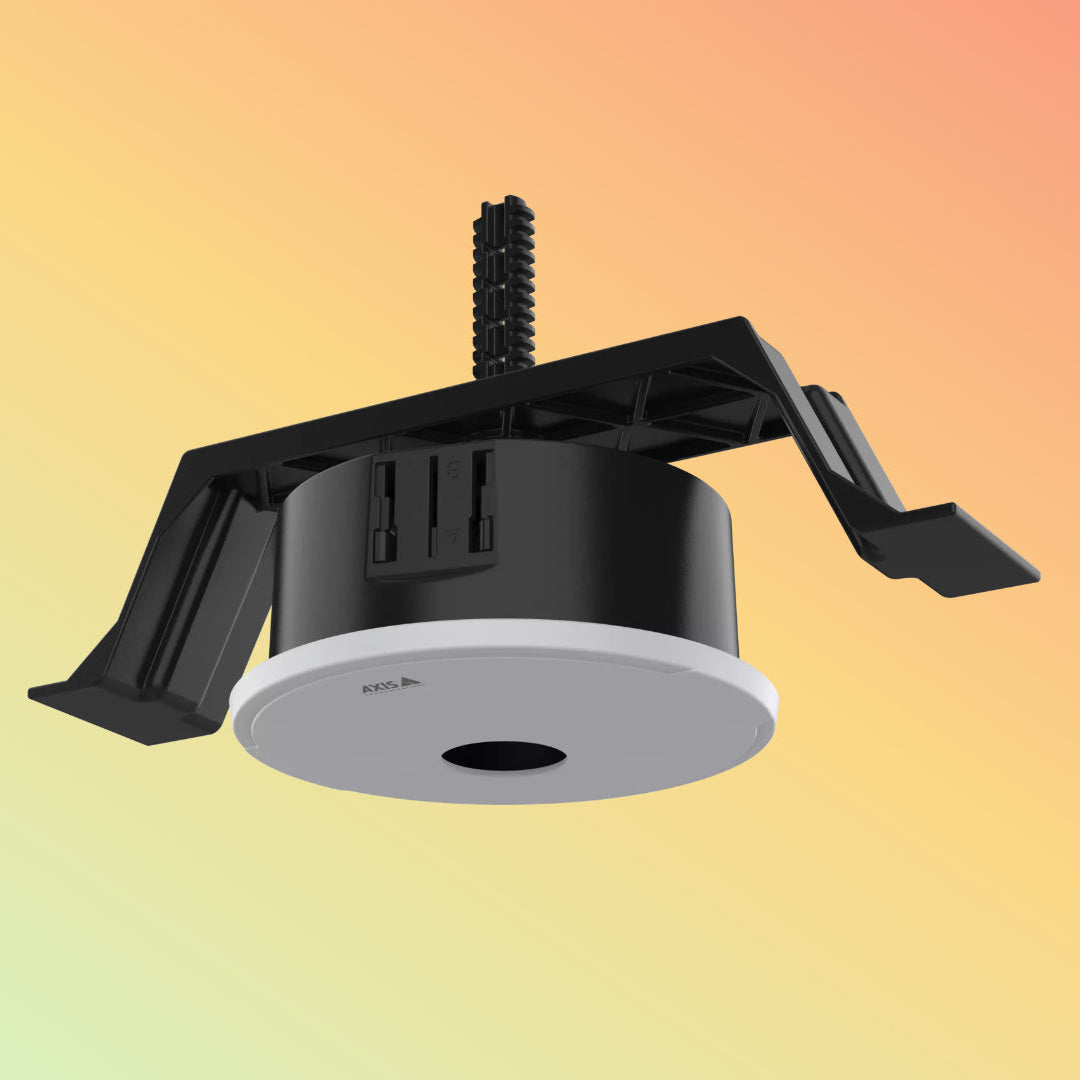 A modern ceiling light fixture with a black mounting bracket and a circular black and white diffuser, shown against a soft yellow-to-orange gradient background.
