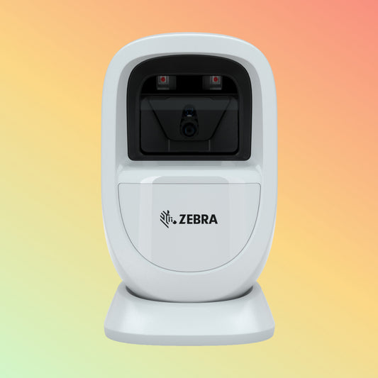 alt="Zebra DS9300 Series Compact 1D Barcode Scanner on Desk"